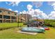 Community kayak storage rack adjacent to waterway and lawn at 5561 Cannes Cir # 5101, Sarasota, FL 34231