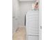 Bright laundry area with a full-size washer and dryer, convenient storage, and tile flooring at 5561 Cannes Cir # 5101, Sarasota, FL 34231