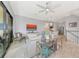 Bright living area with an open floor plan, comfortable seating, and sliding doors to the outside at 5561 Cannes Cir # 5101, Sarasota, FL 34231