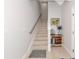Bright stairway showcasing light wood floors, a neutral color palette, and stylish decorative accents at 5561 Cannes Cir # 5101, Sarasota, FL 34231