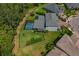 Aerial view of a home with a screened pool, spacious backyard, and well-maintained landscaping at 5805 49Th E Ct, Ellenton, FL 34222