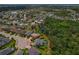 Aerial view showcasing home with pool and pond in a neighborhood at 5805 49Th E Ct, Ellenton, FL 34222