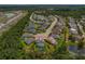 Aerial view showcasing home with pool and pond in a neighborhood at 5805 49Th E Ct, Ellenton, FL 34222