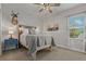 Bedroom with neutral color palette, a deer head mount, and a window with natural light at 5805 49Th E Ct, Ellenton, FL 34222