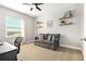 Office/bedroom featuring a gray sofa and a window with blinds and natural light at 5805 49Th E Ct, Ellenton, FL 34222