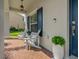 Charming front porch featuring brick flooring, seating, and a welcoming entrance to the home at 5805 49Th E Ct, Ellenton, FL 34222