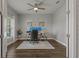 Bright home office with a neutral color scheme, wood-look tile floors, and a modern desk setup at 5805 49Th E Ct, Ellenton, FL 34222