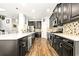 Spacious kitchen featuring stainless steel appliances, dark wood cabinets, and a large island at 5805 49Th E Ct, Ellenton, FL 34222
