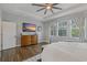 Bright main bedroom with tray ceiling, television, and large windows with natural light at 5805 49Th E Ct, Ellenton, FL 34222