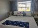 Bright bedroom with nautical themed decorations and natural light at 5858 Midnight Pass Rd # 27, Sarasota, FL 34242