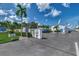Community entrance with lush landscaping, signage and information about Beachaven Villas at 5858 Midnight Pass Rd # 27, Sarasota, FL 34242