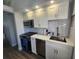 Updated kitchen with stainless steel appliances, quartz countertops, and tile backsplash at 5858 Midnight Pass Rd # 27, Sarasota, FL 34242