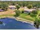 Aerial view of residences featuring screened pools and expansive green lawns at 6011 91St E St, Bradenton, FL 34202