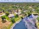 Aerial view of neighborhood homes with sparkling pool and lush green landscaping at 6011 91St E St, Bradenton, FL 34202
