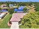 Beautiful aerial view of home featuring a large backyard screened-in lanai and gorgeous water views at 6011 91St E St, Bradenton, FL 34202