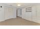 Large bedroom with a ceiling fan, built in shelving, large closets, and a neutral color pallette at 6011 91St E St, Bradenton, FL 34202