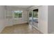 Dining area with built-in cabinets and a sliding glass door with a view of the pool at 6011 91St E St, Bradenton, FL 34202