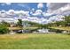 Beautiful waterfront home with a well-maintained lawn and inviting scenery at 6011 91St E St, Bradenton, FL 34202