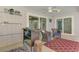 Relaxing screened-in lanai with outdoor seating, shelving, and access to outdoor amenities at 6011 91St E St, Bradenton, FL 34202