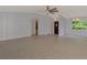 Bright living room with tile flooring and natural light from the entryway and dining area at 6011 91St E St, Bradenton, FL 34202