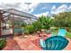 Cozy outdoor patio area with mature plantings, perfect for enjoying the serene surroundings at 6011 91St E St, Bradenton, FL 34202