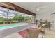 Screened-in lanai with swimming pool, outdoor seating, and lush landscaping, perfect for entertaining at 6011 91St E St, Bradenton, FL 34202