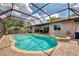 Sparkling pool and spa in screened enclosure, seamlessly blending indoor and outdoor living at 6011 91St E St, Bradenton, FL 34202