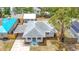 Overhead aerial view of single story home with side carport; landscaped yard at 609 25Th W Ave, Bradenton, FL 34205