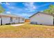 Backyard with detached garage, patio, and grass at 609 25Th W Ave, Bradenton, FL 34205