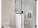 Bathroom featuring a luxurious glass enclosed shower with marble tiles and brushed black accents at 609 25Th W Ave, Bradenton, FL 34205