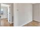 Spacious bedroom with wood-look floors, updated paint, and views into the next room at 609 25Th W Ave, Bradenton, FL 34205