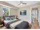 Stylish bedroom featuring a plush bed, mounted tv, and wood-look floors at 609 25Th W Ave, Bradenton, FL 34205