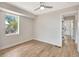 Bright bedroom with neutral paint, updated floors, a ceiling fan and large windows at 609 25Th W Ave, Bradenton, FL 34205
