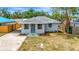 Charming single-story home with a well-maintained lawn and a welcoming front entrance at 609 25Th W Ave, Bradenton, FL 34205