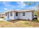 Front exterior view of home with light colored siding and landscaping at 609 25Th W Ave, Bradenton, FL 34205