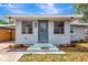 A welcoming entrance with a decorated front door and green steps leading to the home at 609 25Th W Ave, Bradenton, FL 34205