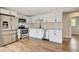 Bright kitchen with stainless steel appliances, white cabinets and plenty of storage at 609 25Th W Ave, Bradenton, FL 34205
