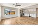 Open living room featuring hardwood floors and bright light flowing in to an open concept kitchen at 609 25Th W Ave, Bradenton, FL 34205