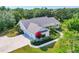 Beautiful aerial view of a single-story house showing the roof, landscaping, and driveway at 6102 9Th Avenue Cir Ne, Bradenton, FL 34212