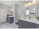 Bathroom with double vanity sinks and a large mirror, perfect for a Gathering at 6102 9Th Avenue Cir Ne, Bradenton, FL 34212