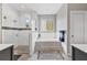 Bathroom with a luxurious soaking tub, a glass-enclosed shower, and modern tiling at 6102 9Th Avenue Cir Ne, Bradenton, FL 34212