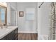 Inviting bathroom featuring a vanity with a sink, shower and bath at 6102 9Th Avenue Cir Ne, Bradenton, FL 34212