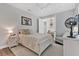 Bright bedroom with a ceiling fan and a peaceful atmosphere at 6102 9Th Avenue Cir Ne, Bradenton, FL 34212