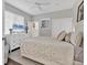 Bright bedroom with a ceiling fan, closet and dresser featuring plenty of storage space at 6102 9Th Avenue Cir Ne, Bradenton, FL 34212