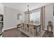 Traditional dining room featuring a wooden table, stylish chandelier, and decorative mirror for Gathering gatherings at 6102 9Th Avenue Cir Ne, Bradenton, FL 34212