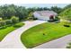 Gorgeous single-story home featuring a long driveway and lush landscaping, providing excellent curb appeal at 6102 9Th Avenue Cir Ne, Bradenton, FL 34212
