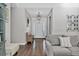 Open foyer featuring a bench and seamless flow into the living area, offering an airy ambiance at 6102 9Th Avenue Cir Ne, Bradenton, FL 34212