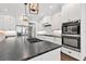 Spacious kitchen island with stainless steel appliances and a double oven at 6102 9Th Avenue Cir Ne, Bradenton, FL 34212