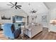 Spacious living room with vaulted ceilings, hardwood floors, and an entertainment center at 6102 9Th Avenue Cir Ne, Bradenton, FL 34212