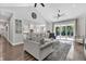 Spacious living room with open layout, combining modern decor with a view of the backyard at 6102 9Th Avenue Cir Ne, Bradenton, FL 34212